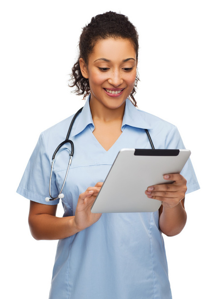 Doctor or nurse with stethoscope and tablet pc - Valokuva, kuva