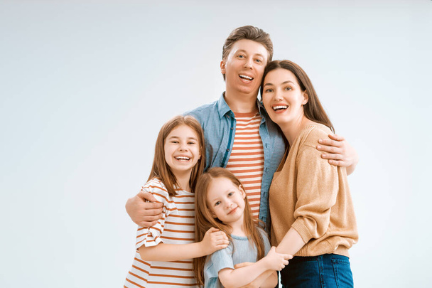 Happy loving family. Mother, father and children daughters on white background.  - Φωτογραφία, εικόνα