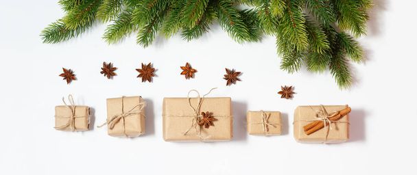 Christmas flat lay banner with copy space mockup. Present boxes and fir tree branches composition. New year holidays gifts packaging - Fotografie, Obrázek