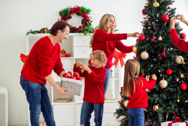 Portrait of nice attractive friendly big full cheerful family small little kids decorating tree Eve Noel day help assistance upbringing in light white apartment house indoor - Photo, Image