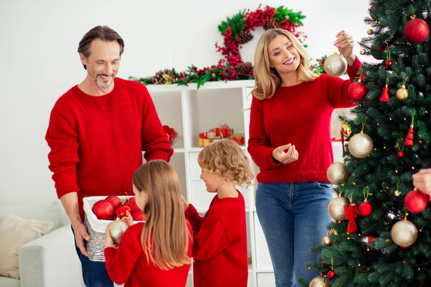 Portrait of his he nice attractive friendly cheerful big full family decorating tree Eve Noel help assistance daydream spirit holly jolly in light white apartment house indoor - Foto, Imagem