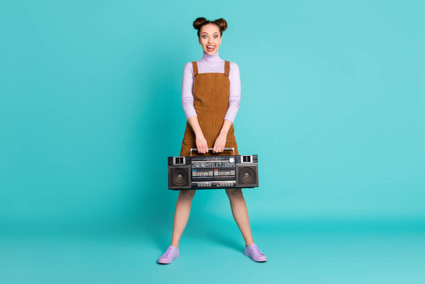 Full size photo of pretty cheerful two buns hairdo girlfriend millennial dj play retro music hold recorder wear fall violet shoes sweater short brown dress isolated turquoise color background - Фото, изображение