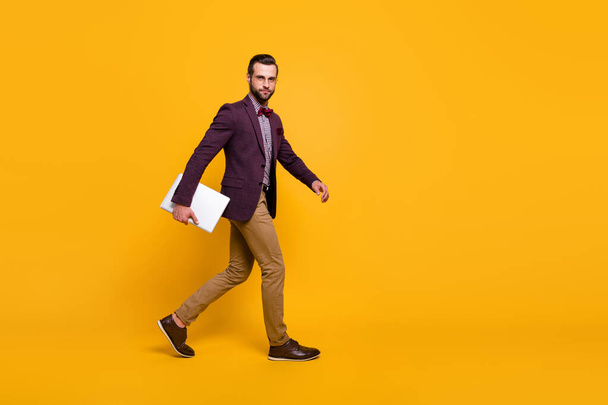 Full length profile photo of handsome rich clothes stylish guy well-dressed business man walk meeting hold notebook wear plaid shirt blazer trousers shoes isolated yellow color background - Foto, Bild