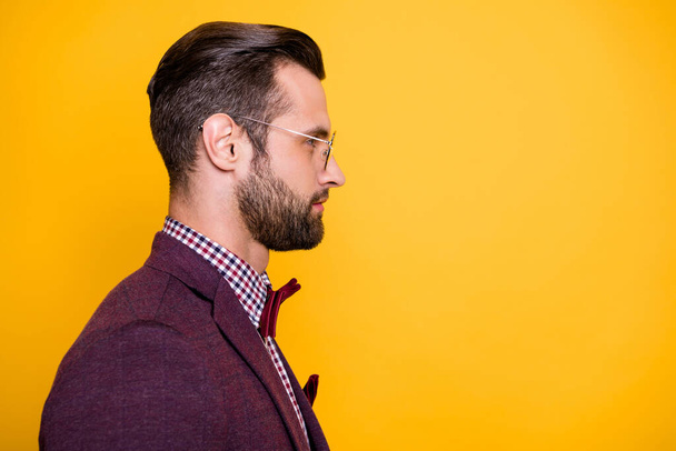 Close-up profile side view portrait of his he nice attractive calm content well-groomed guy macho wearing specs isolated over bright vivid shine vibrant yellow color background - Fotografie, Obrázek