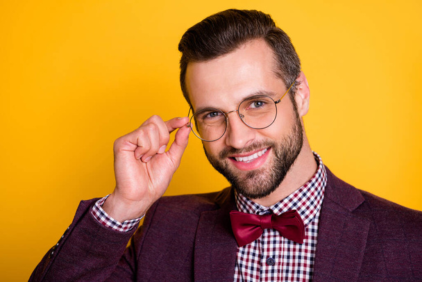 Closeup photo of handsome cheerful rich clothes guy business man beaming smiling hold hand vision specs wear plaid shirt blazer isolated yellow bright color background - Valokuva, kuva