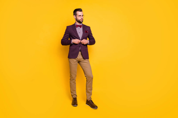 Full length body size view of his he nice attractive content fashionable guy boyfriend fastening button dressing isolated over bright vivid shine vibrant yellow color background - Fotoğraf, Görsel