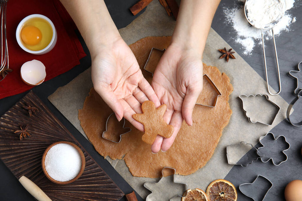 Woman making Christmas cookies at table, top view - Photo, Image