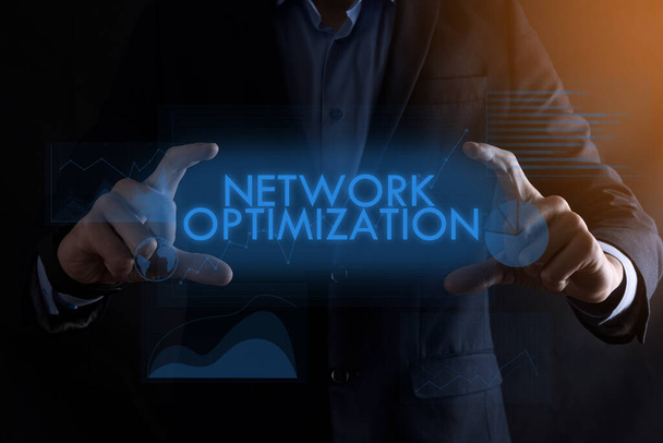 Business man hands holding inscription NETWORK OPTIMIZATION with different graphs on the background.Business, Technology, Internet and network concept. - Photo, Image