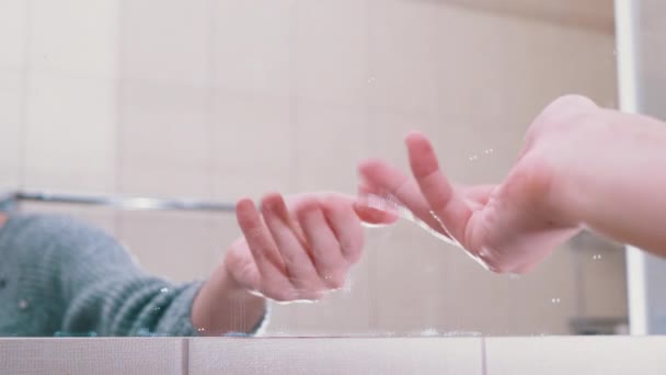 Beckoning Female Hand in Mirror Reflection in Bathroom. Finger Gestures. - Кадри, відео