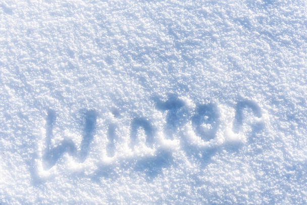 Full frame fresh snow texture background with winter text - Photo, Image