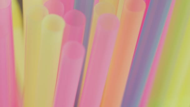 Multicolored plastic cocktail tubes, camera movement, rack focus, close-up - Footage, Video