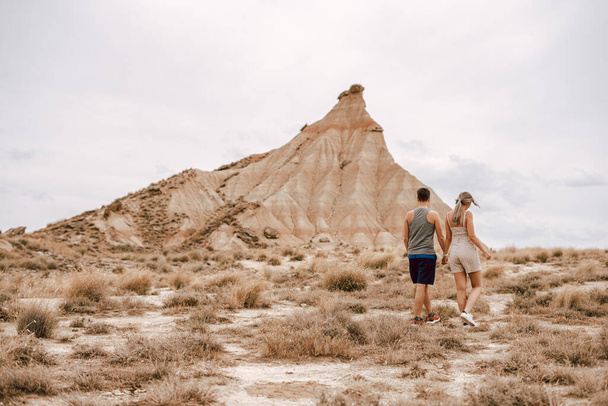 Young couple on the Barcenas Reales desert in Navarra, Spain - 写真・画像
