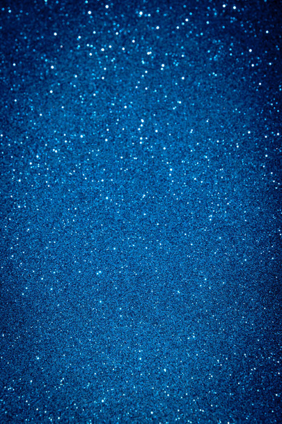 Blue color blured sparkling background with focused area. - Photo, Image