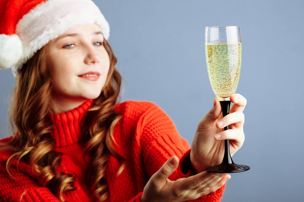 Sexy happy woman with champagne glass isolated on gray background. Selective focus. - 写真・画像
