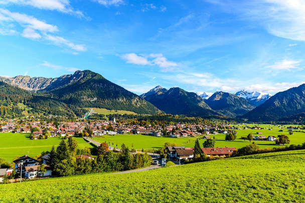 Panorama view on Obersdorf in Allgau.  Nebelhorn mouintain, Bavaria, Bayern, Germany. Big (Gross) Klottenkopf, alps Mountains in Tyrol, Austria - Photo, Image
