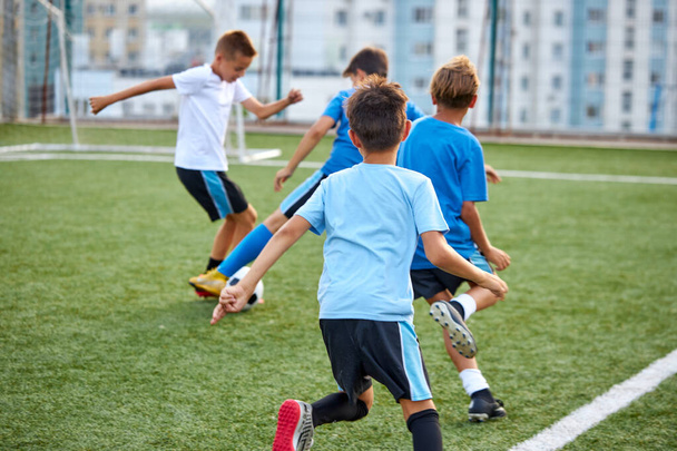 young footballers on football match in stadium - Valokuva, kuva
