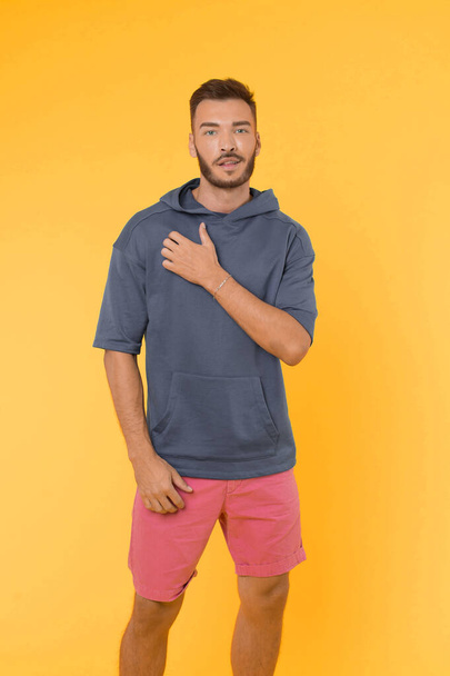 Clothing for active lifestyle. Choose comfortable clothes made out of soft textile to stay active. Man athletic appearance wear stylish clothes for youth. Comfortable outfit for active leisure - Foto, afbeelding