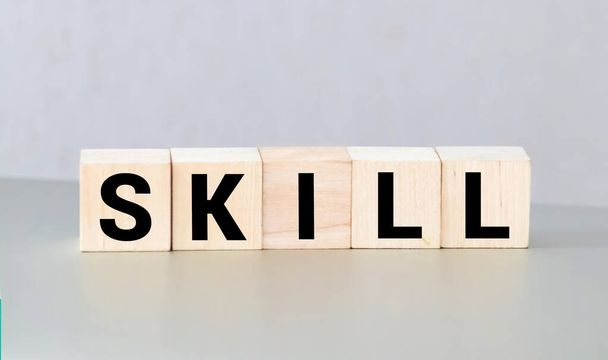 Skill word on wooden cubes. business and motivation concept - Foto, imagen
