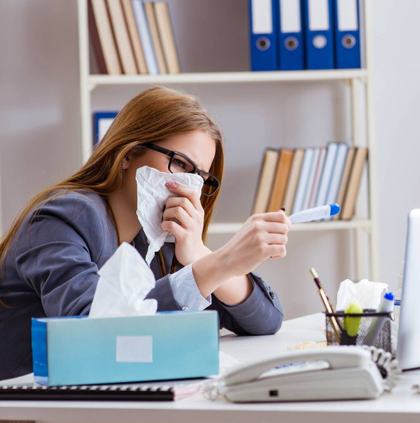 Businesswoman employee sick in the office - Foto, afbeelding