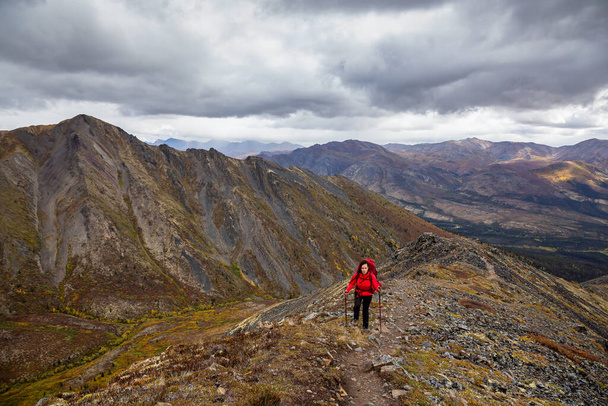 Woman Backpacking on Scenic Rocky Hiking Trail - Photo, image
