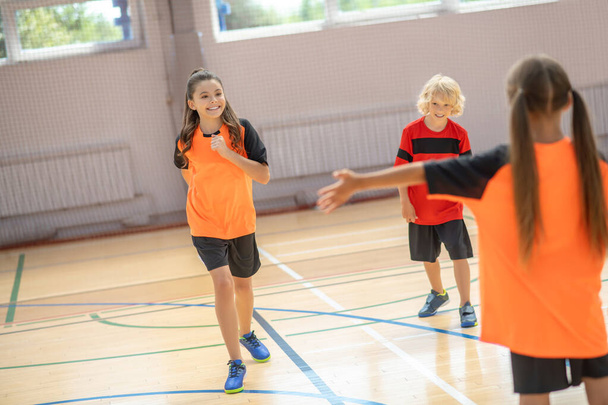 Kids in bright sportswear spending time in the gym - Foto, Bild