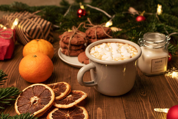 Christmas breakfast. Coffee. Biscuit. Marshmallow. Mandarins. Dried oranges. Gifts. Side view. - Фото, изображение