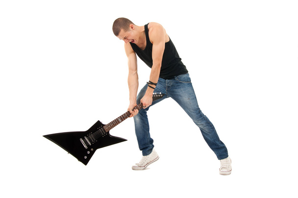 Trying to break a guitar - Photo, Image
