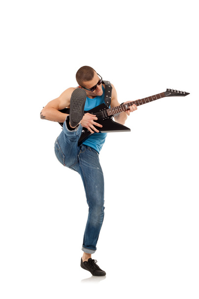 Kicking guitarist - Photo, image
