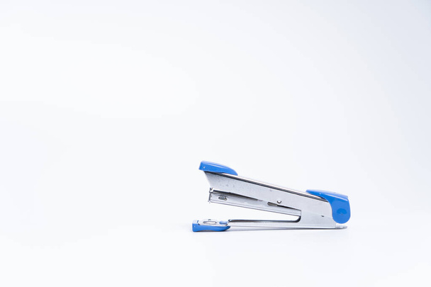 Blue stapler isolated on a white background. - Foto, afbeelding