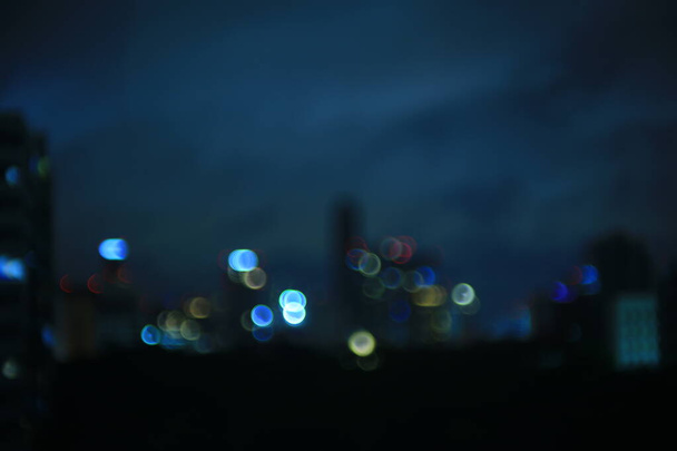 dark life city theme. out of focus bokeh light from business district Urban skyline. graphic resource for technology theme and horror feeling city. - Photo, Image