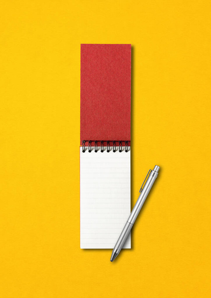 Blank open spiral notebook and pen mockup isolated on yellow - Photo, image