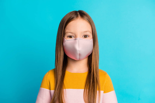 Photo of nice-looking long-haired pre-teen girl wear sweater respirator isolated over bright vivid blue color background - Foto, Bild
