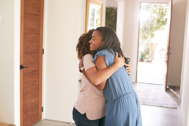 Loving Senior Mother Hugging Adult Daughter Indoors At Home - Zdjęcie, obraz