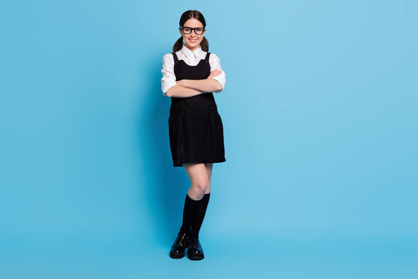 Full length body size view of her she nice-looking charming attractive pretty lovely content cheerful schoolgirl nerd geek folded arms isolated over bright vivid shine vibrant blue color background - Photo, Image