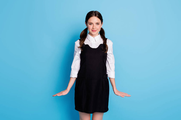 Portrait of her she nice attractive pretty charming cute modest fashionable cheery schoolgirl posing wearing dress isolated on bright vivid shine vibrant blue color background - Foto, afbeelding
