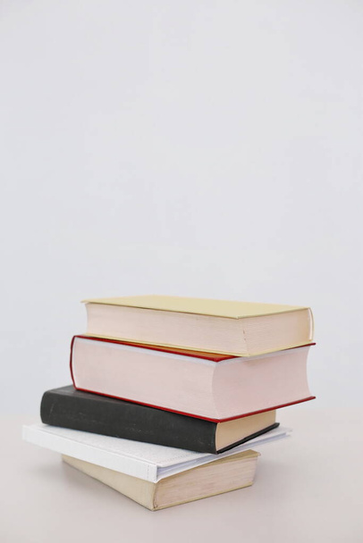 Stack of books on white background - Фото, изображение
