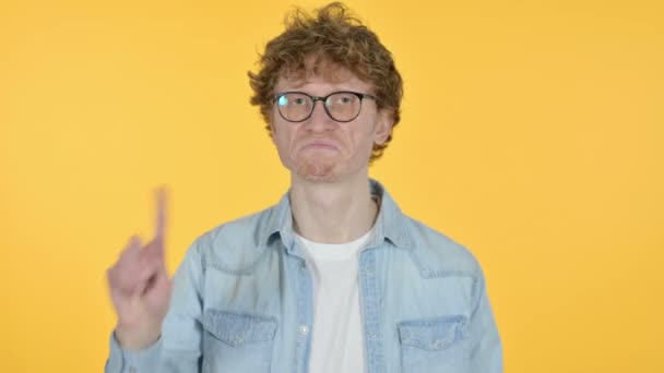 Redhead Young Man No Sign by Finger, Yellow Background  - Footage, Video