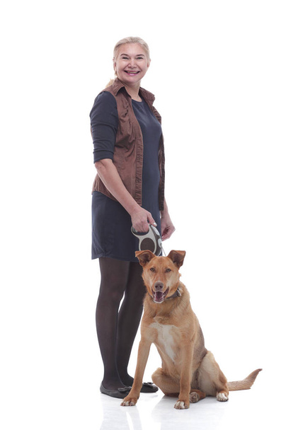 in full growth. female dog handler with a pet dog. - Foto, Bild