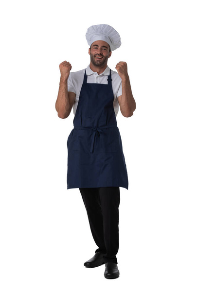 Male cook in apron and hat holding fists isolated on white background full length studio portrait - Foto, immagini