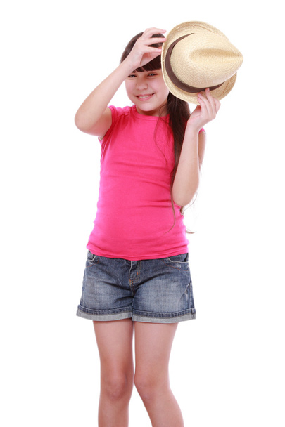 Girl with straw hat on white background - Foto, afbeelding