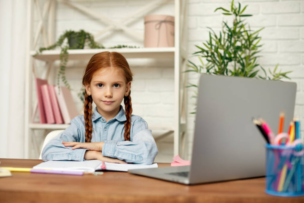 little child girl using laptop for studying online - Фото, изображение