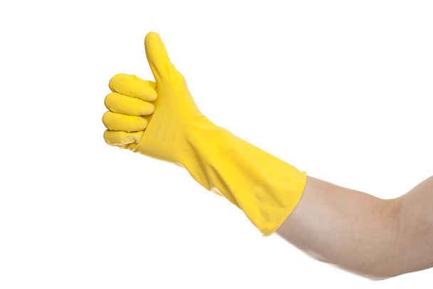 yellow glove for cleaning on arm show thumbs up - Valokuva, kuva