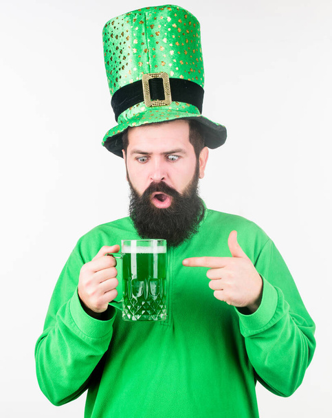 Alcohol consumption integral part saint patricks day. Irish tradition. Man brutal bearded hipster drink pint beer. Irish pub. Green beer mug. Drinking beer part celebration. Bar seasonal holiday menu - Foto, Imagen