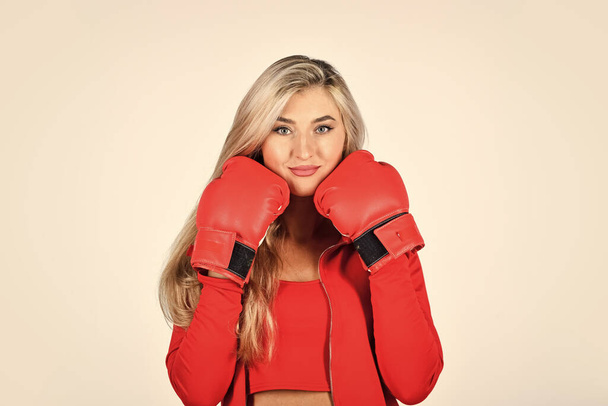 Sport girl. Fitness trainer. Facial skin. Skin care. Elastic skin. Use collagen for firmness. Face massage. Beauty salon. Cosmetology beauty procedure. Wrinkles treatment. Woman boxing gloves - Foto, immagini