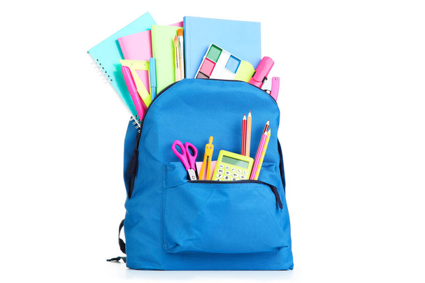 Backpack with school supplies isolated on white background - Foto, afbeelding