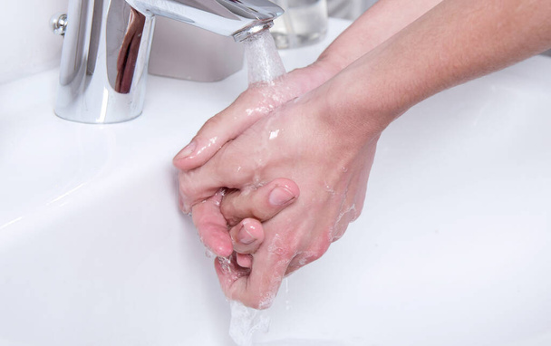 Man washing hands with soap. For corona virus prevention and hygiene - Photo, Image