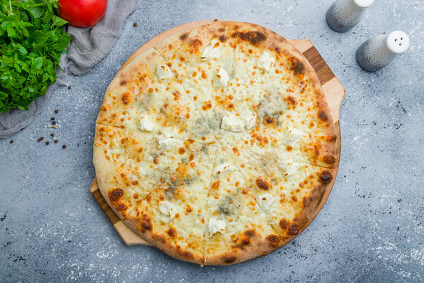 Pizza Quattro formaggi on beautiful grey table - 写真・画像
