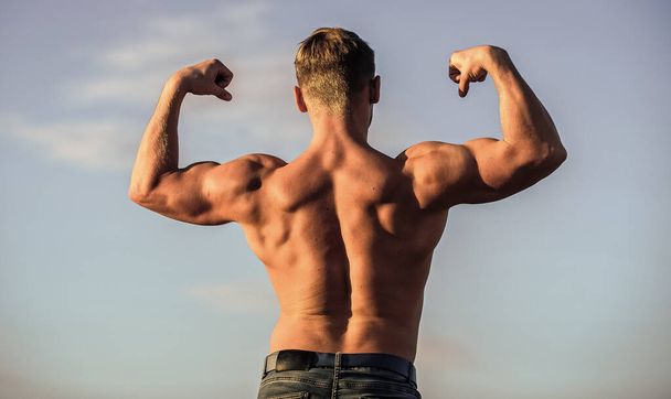 Bodybuilder shape. Sexy body. Triumph and loss. Bigger muscles grow. Increase overall muscle mass. Man muscular chest naked torso sky background. Man muscular athlete bodybuilder show muscles - Φωτογραφία, εικόνα