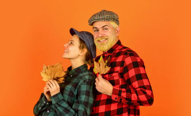 Carefree time together. retro couple autumn leaves. man and woman hold maple leaf. farmer countryside collect fallen leaves. fall seasonal concept. Autumn harvest with Farmers. Happy Thanksgiving day - Фото, изображение