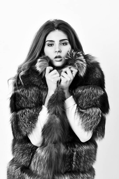 Fur fashion concept. Woman makeup and hairstyle posing mink or sable fur coat. Winter elite luxury clothes. Female brown fur coat. Fur store model enjoy warm in soft fluffy coat with collar - Foto, afbeelding